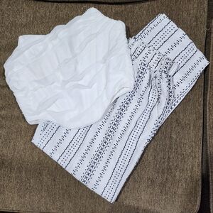 White and Black Patterned Pants With White Strapless Top